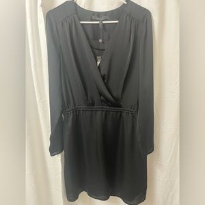 BCBG MAXAZRIA v-neck ,Long sleeve black dress. Length right above the knee.
